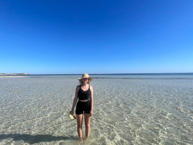 Standing in the gorgeous waters at Coral Bay