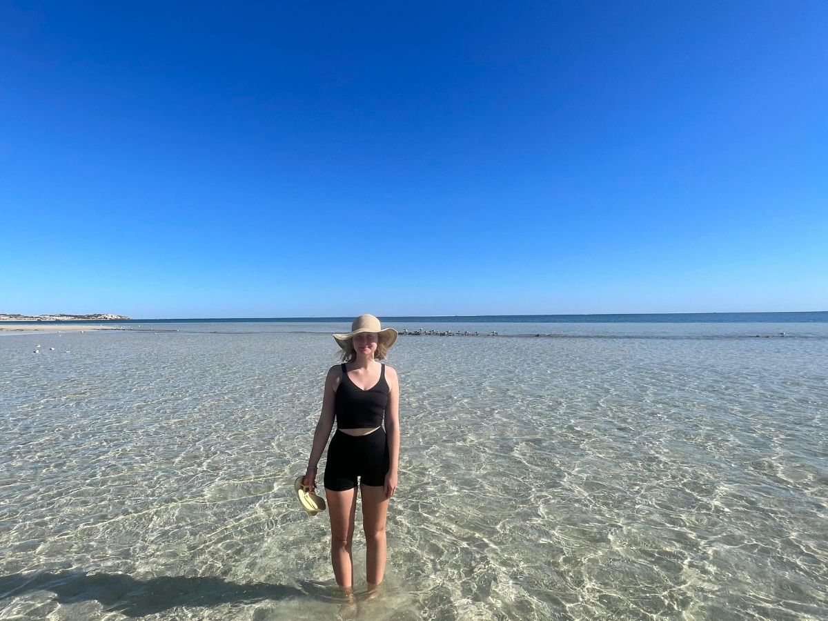 Standing in the gorgeous waters at Coral Bay